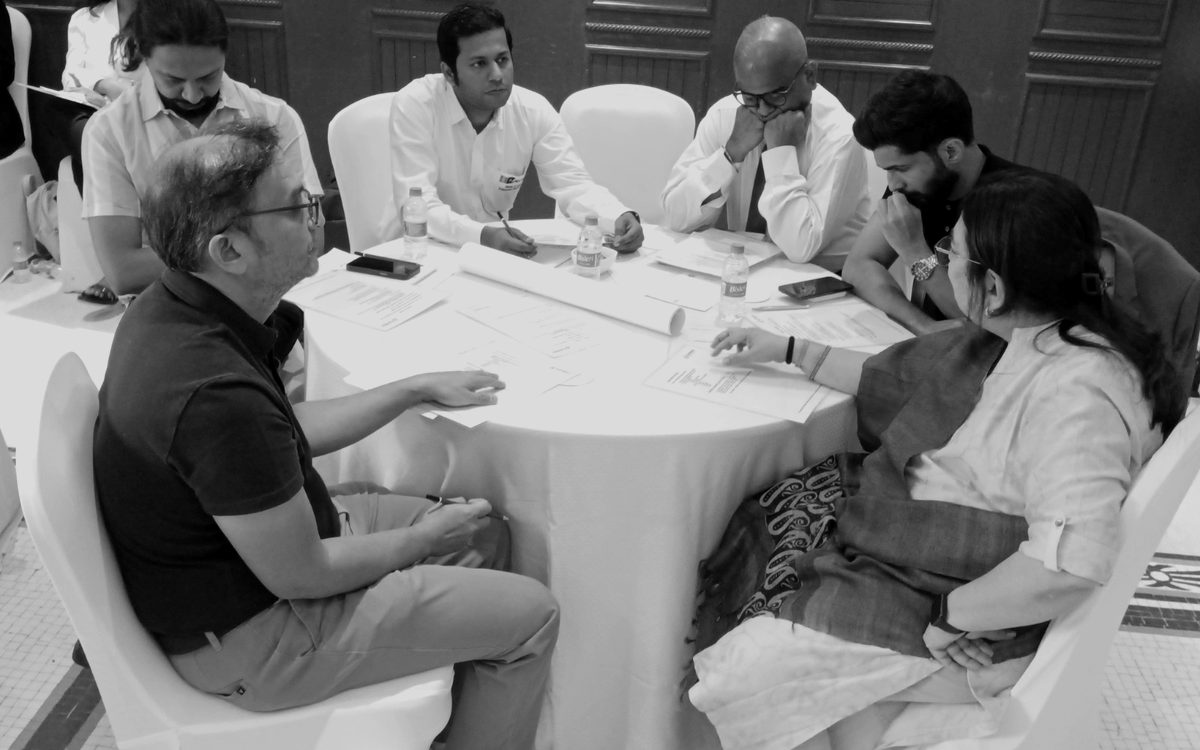 Workshop participants working through their own IP audit at a table